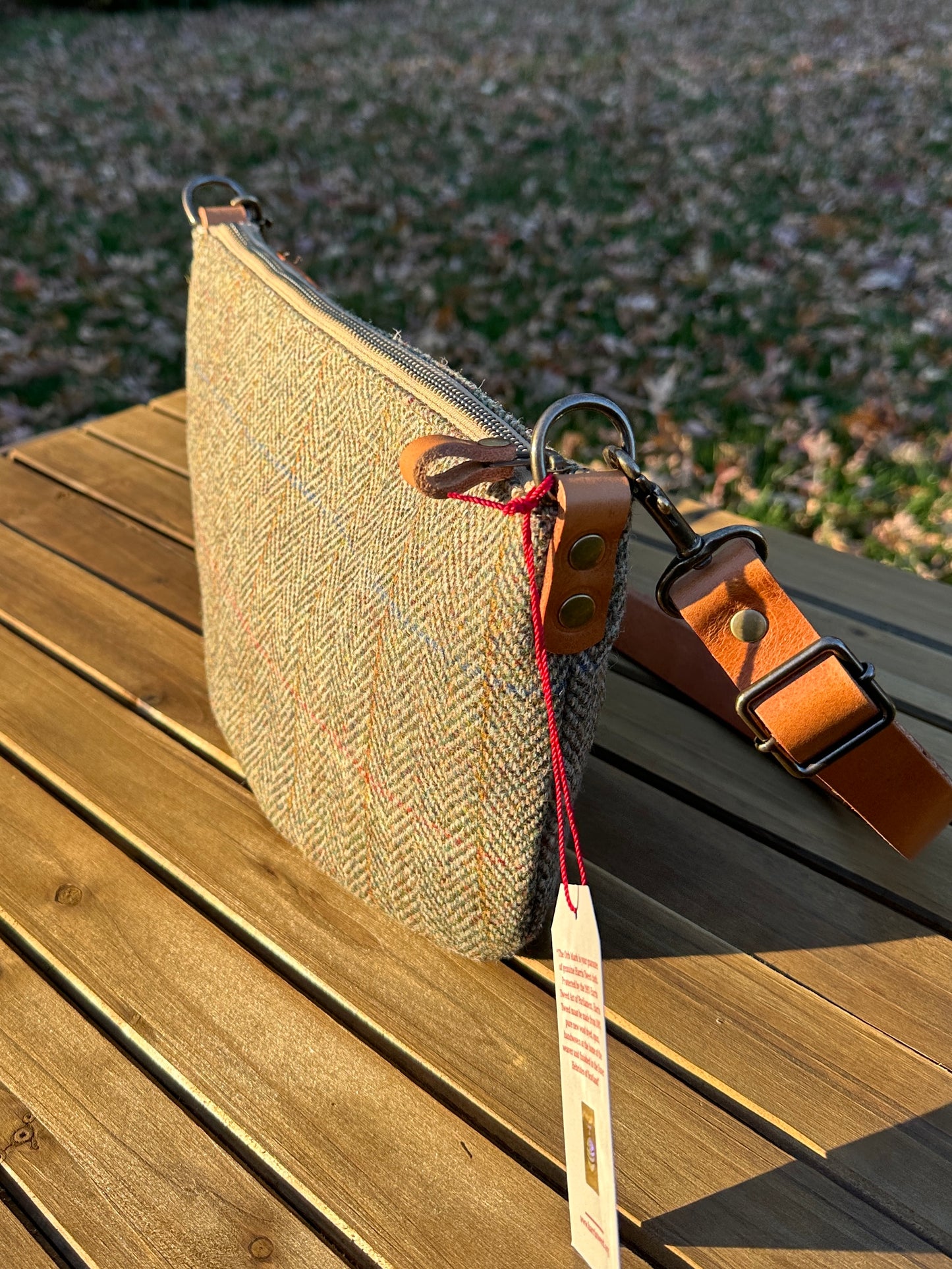 Green Herringbone Harris Tweed® Holland Island Crossbody bags with adjustable and antique brass hardware.