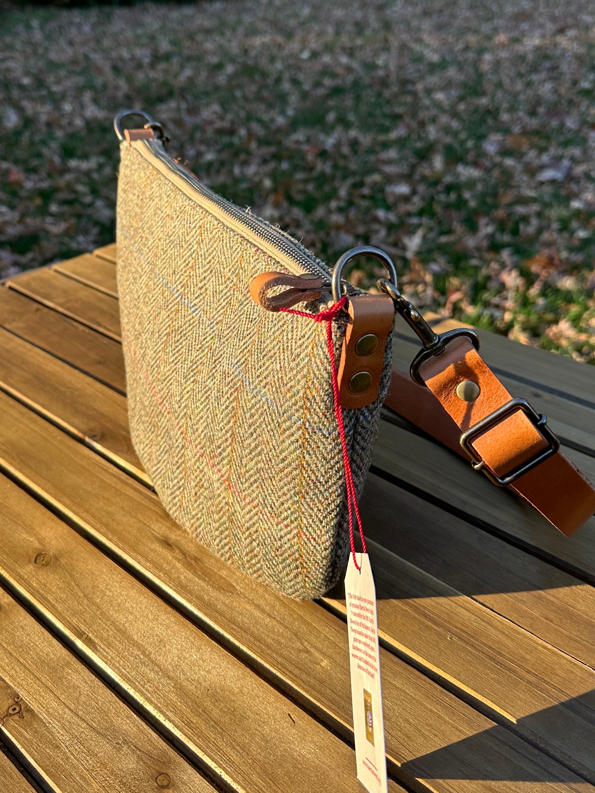 Green Herringbone Harris Tweed® Holland Island Crossbody bags with adjustable and antique brass hardware.