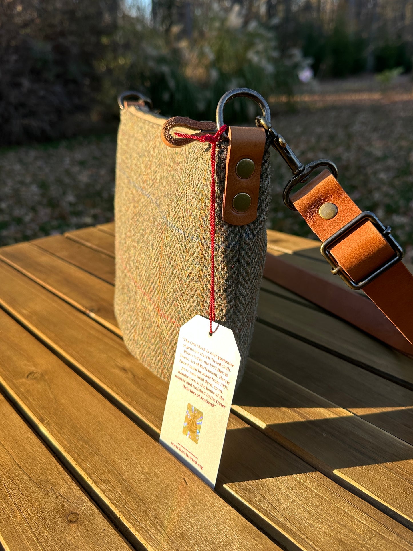 Green Herringbone Harris Tweed® Holland Island Crossbody bags with adjustable and antique brass hardware.