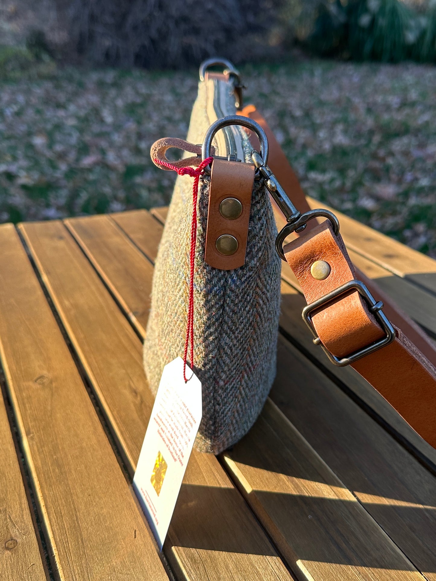 Green Herringbone Harris Tweed® Holland Island Crossbody bags with adjustable and antique brass hardware.
