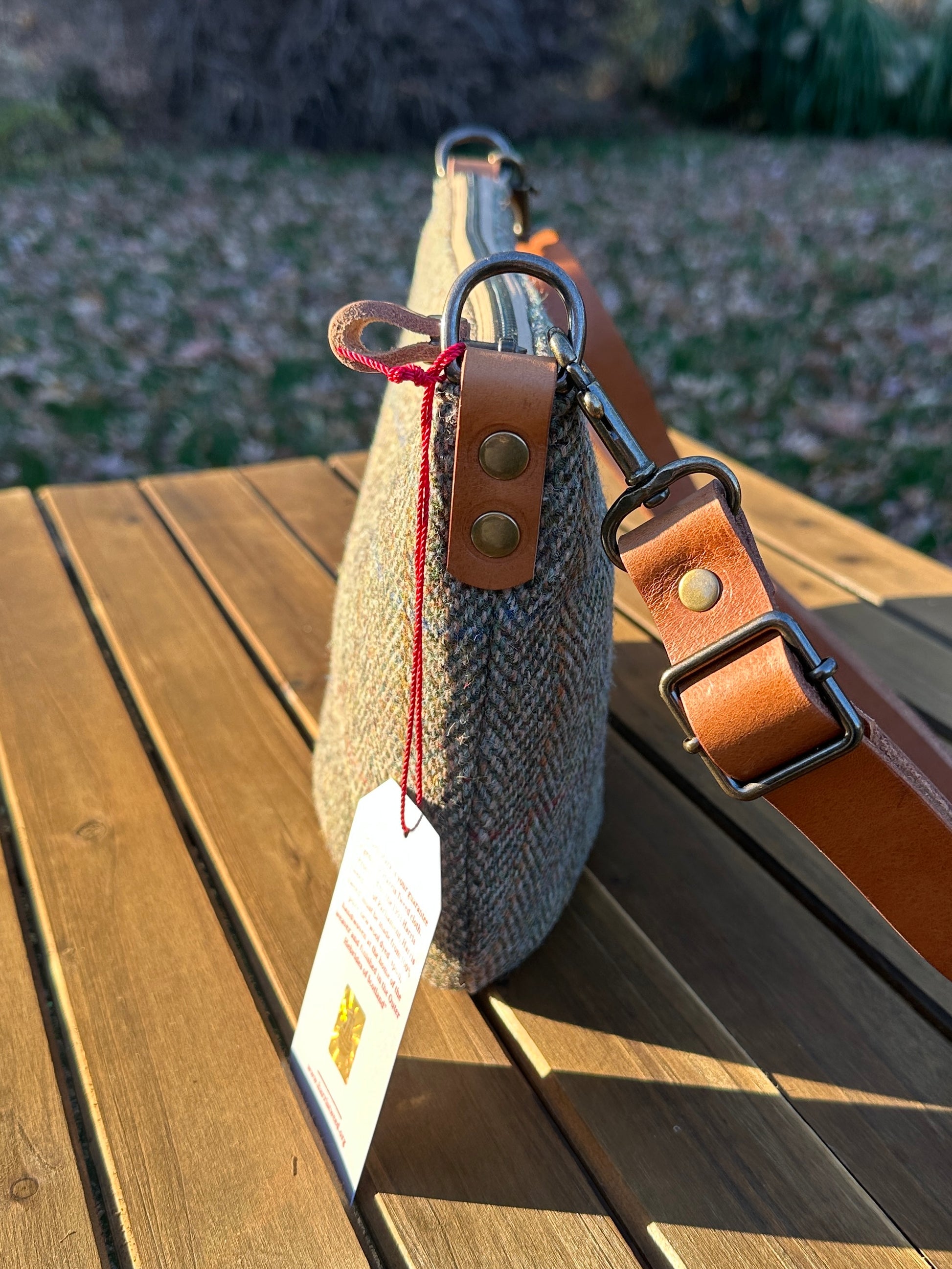 Green Herringbone Harris Tweed® Holland Island Crossbody bags with adjustable and antique brass hardware.