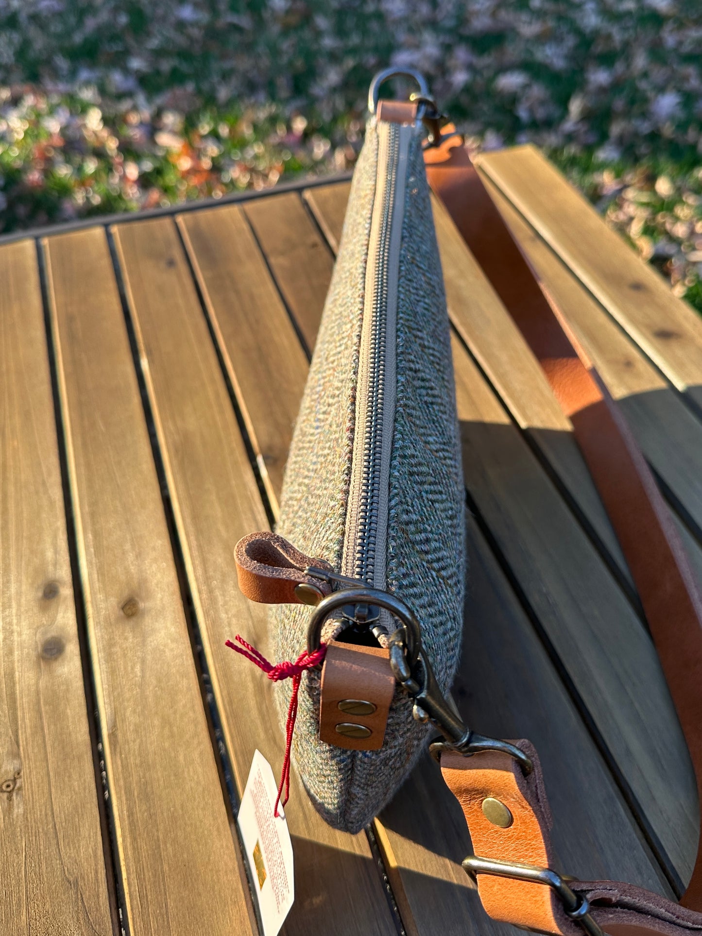 Green Herringbone Harris Tweed® Holland Island Crossbody bags with adjustable and antique brass hardware.