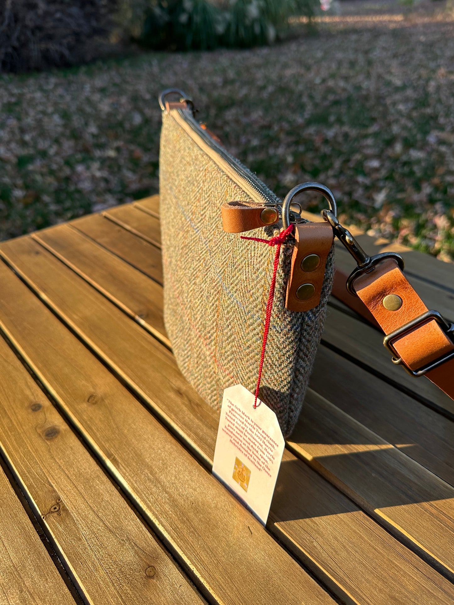 Green Herringbone Harris Tweed® Holland Island Crossbody bags with adjustable and antique brass hardware.