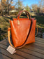 Back view of the Cherry West Street Crossbody bag made with vegetable-tanned leather.
