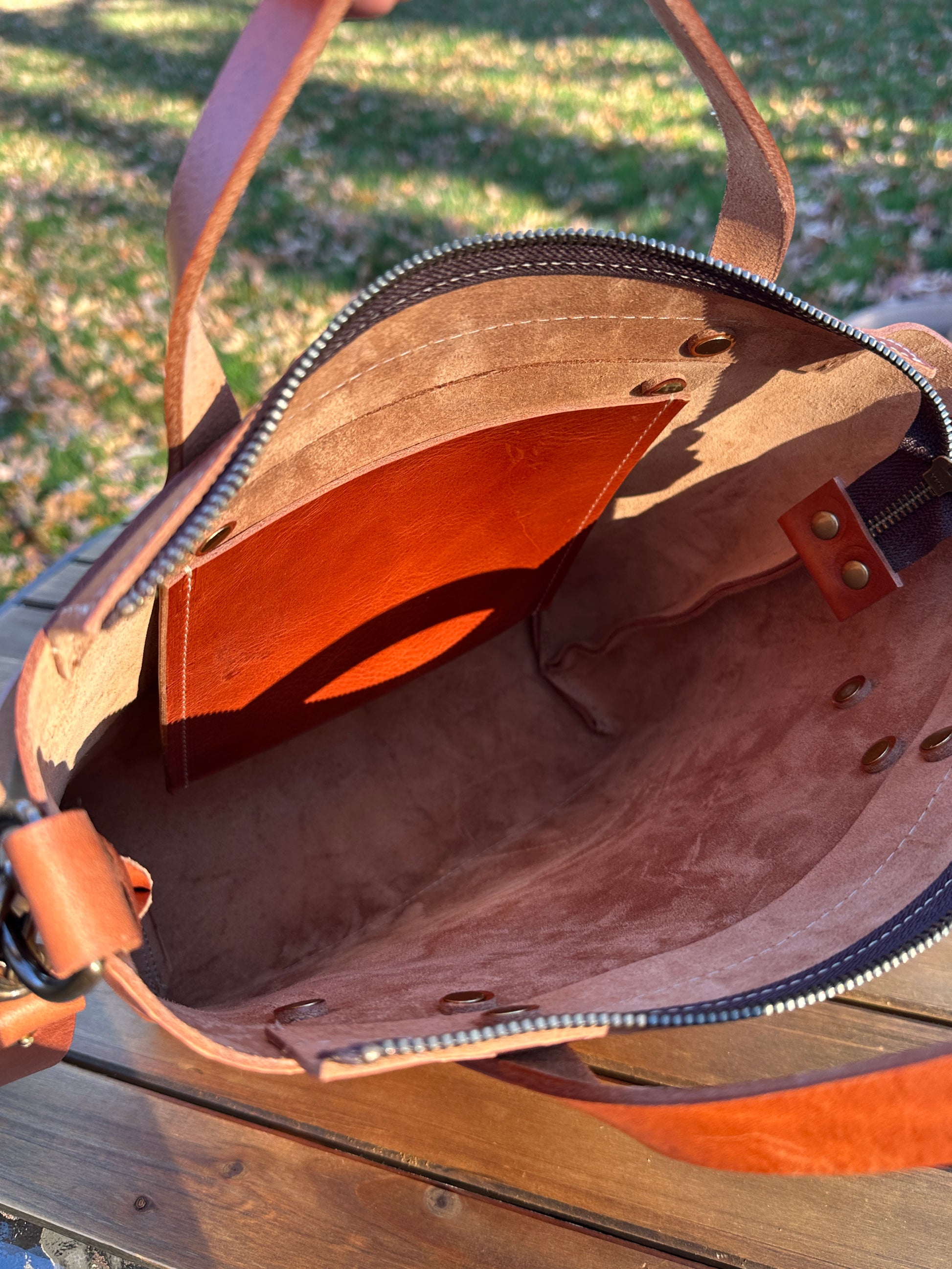 Inside view of the Cherry West Street Crossbody bag made with vegetable-tanned leather.