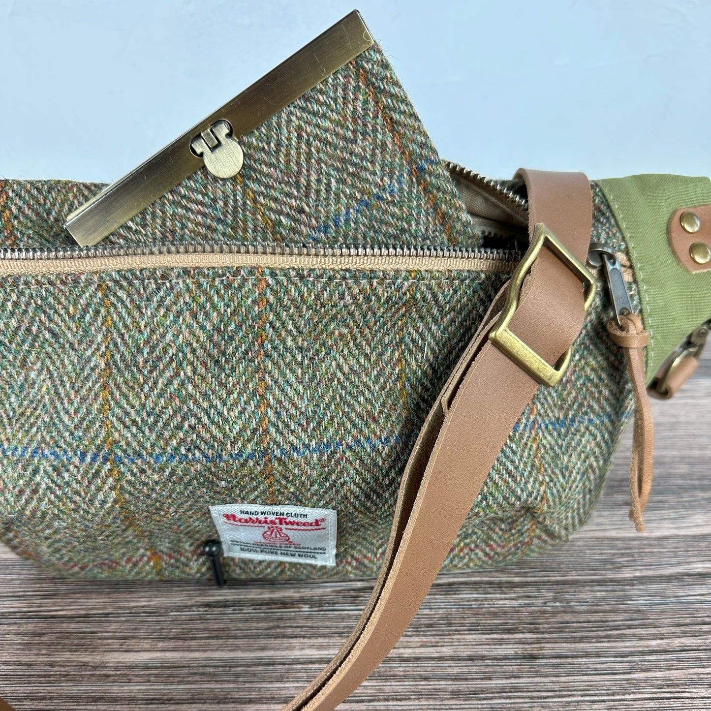 Green Herringbone with Blue & Gold Overcheck Harris Tweed® Wheat Leather Strap Antique Brass Hardware Spinnaker Sling Bag squirescanvascreations.com