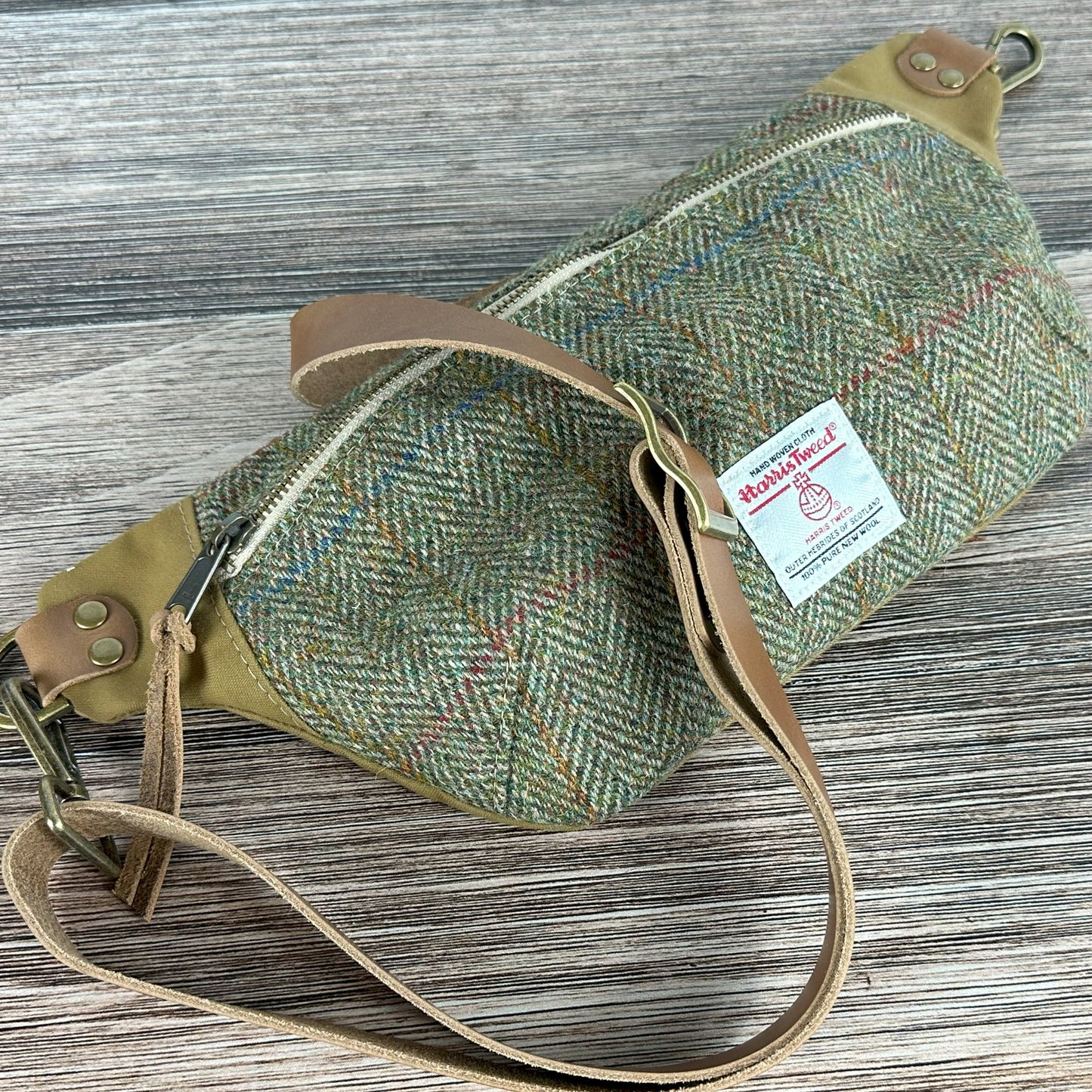 Green Herringbone with Blue & Gold Overcheck Harris Tweed® Wheat Leather Strap Antique Brass Hardware Spinnaker Sling Bag squirescanvascreations.com