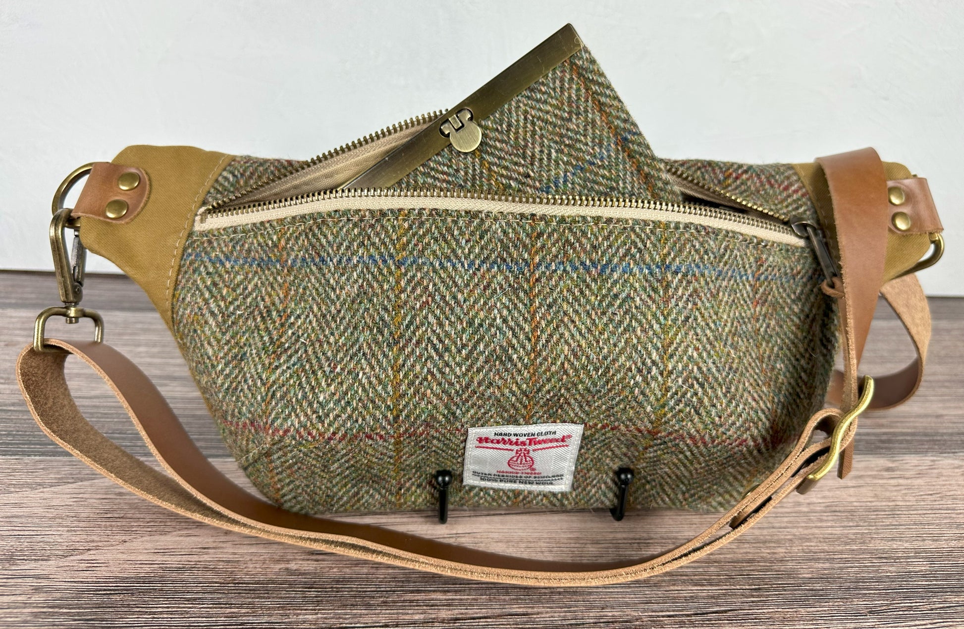 Green and Blue Herringbone with a Rust Overcheck Harris Tweed® Wheat Leather Strap Antique Brass Hardware Spinnaker Sling Bag squirescanvascreations.com