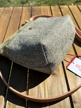 Close-up of the Barra Crossbody 4-1/2 inch deep structured base of a Harris Tweed crossbody bag. Highlights the durable Barleycorn weave and professional craftsmanship of this deceptively spacious artisan purse.