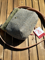 Detailed view of the rounded bottom corners and deep 4-1/2 inch profile of the Barra bag. This high-capacity crossbody stands upright and is lined with premium Essex Linen.