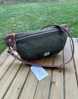 Minimalist sling bag handcrafted with Green plaid Harris Tweed® and Horween Brown Nut Leather, finished with Antique Brass hardware.