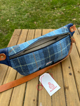 Minimalist sling bag handcrafted with Blue Plaid Tartan plaid Harris Tweed® and Horween Cobalt Leather, finished with Antique Brass hardware.